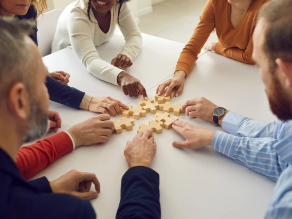 Group putting puzzle together